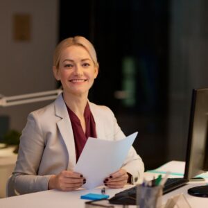 smiling woman with papers
